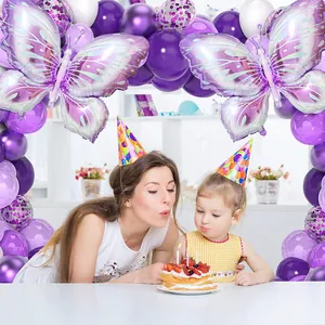 Detail of purple butterfly balloon arch with sequin balloons for girl birthday party