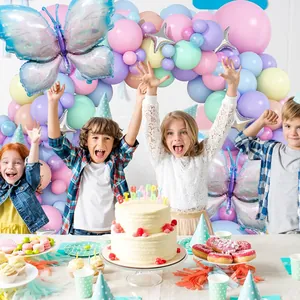 Detail of macaron balloon arch with laser blue butterfly and star balloons for party