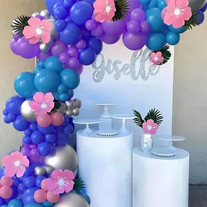 Blue and purple balloon garland kit with metallic silver accents and floral decorations