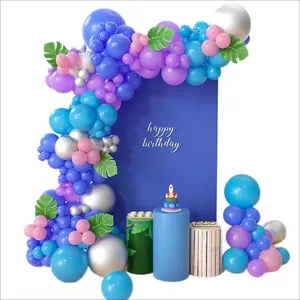 Blue and purple balloon garland kit with silver accents and monstera leaves for birthday parties