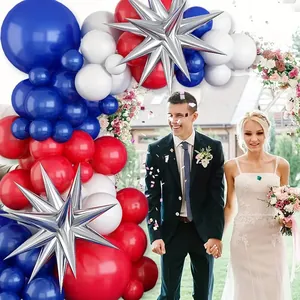 Outdoor patriotic party decor featuring red white and blue balloon arch with silver starbursts