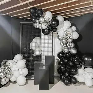 Silver and black balloon arch kit with metallic and confetti balloons on geometric stands
