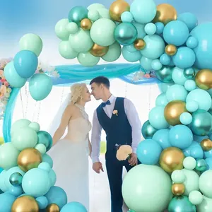 Detail of mint green and champagne gold balloon arch garland for party decoration