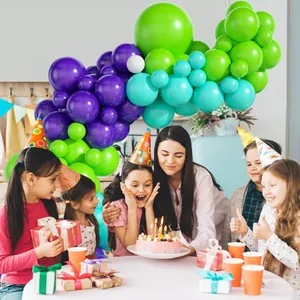 Blue, purple and green balloon arch kit used for a cozy family birthday party setting