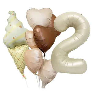 Detail of cream ice cream cone balloon and heart-shaped foil set for 2nd birthday