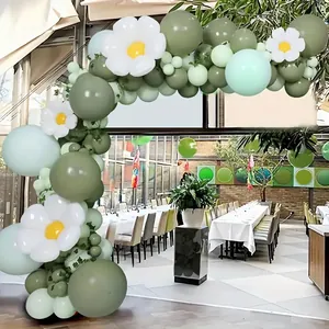 Detail of forest style balloon arch with olive green, mint and daisy balloons