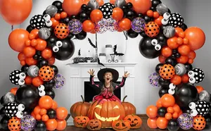 Halloween balloon arch with orange, black, and marble balloons around a white fireplace