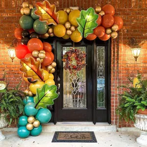 Detailed outdoor view of Thanksgiving balloon arch with autumn leaves and festive colors