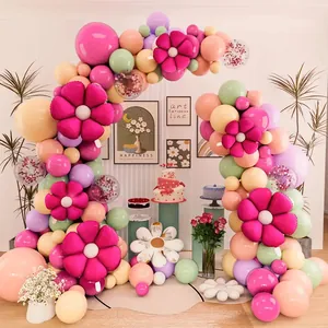 Macro detail of daisy flower balloons and colorful macaron balloon arch for party decor