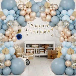 Blue and gold balloon arch kit with Happy Birthday banner and palm leaves decor