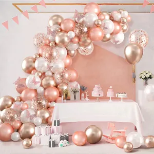 Rose gold balloon arch kit with white latex balloons and pink butterfly stickers for party decor