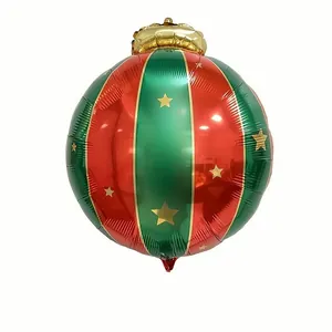 Detail of red and green striped Christmas bauble balloon with gold stars for party decor