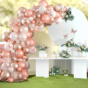 Rose gold balloon arch kit with metallic balloons and 3D hollow butterflies for party decor