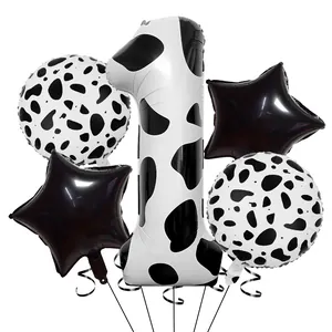 Détail du lot de 5 ballons motif vache avec grand chiffre 1 et formes d'étoiles