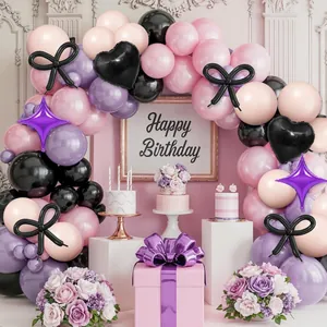 Pink and purple balloon arch kit with black bows and heart balloons for birthday party decor