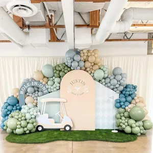 Morandi blue and green golf-themed party balloon garland arch set with a backdrop