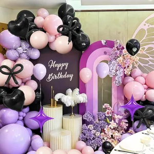 Pink and purple balloon arch kit featuring heart shapes and Happy Birthday backdrop