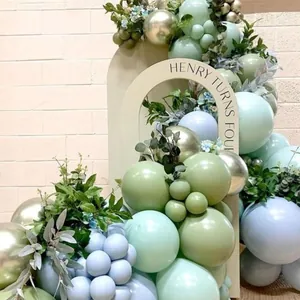 Sage green and blue balloon garland arch kit with silver accents and floral leaves