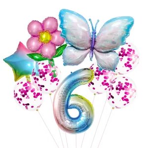 Detail view of butterfly, number 6, and flower foil balloons with confetti latex balloons