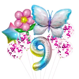 Detail view of butterfly and number nine balloon set with pink confetti latex balloons