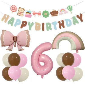 Birthday decoration set with macaron banners, bow balloons, and rainbow foil balloons