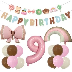 Detailed set of matte bow foil balloon, birthday banner, and colorful party decorations