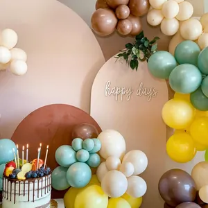 Detail of jungle themed balloon arch with matte beige brown and sage green latex balloons