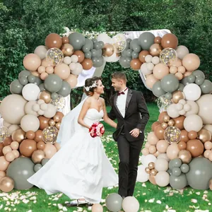 Boho wedding balloon arch kit with matte mocha sand and gold latex balloons in garden