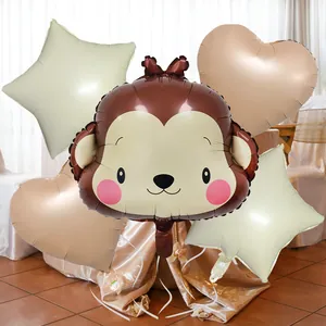 Close-up of animal balloon set featuring a brown monkey and cream star shapes