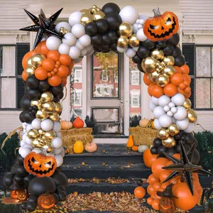 Halloween balloon arch kit with orange black and gold latex balloons and pumpkin foil stars