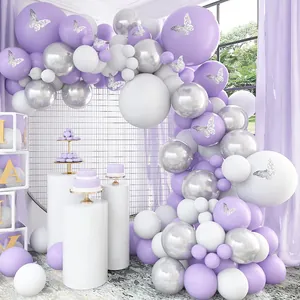 Detail of purple and silver balloon arch with decorative hollow butterfly stickers