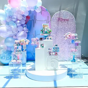 Detail of macaron balloon arch with purple sequin backdrop and Alice party decorations