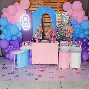 Macro view of pastel balloon arch kit with pink blue balloons and neon digit decoration