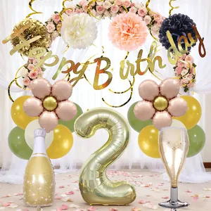 Birthday party set with champagne foil balloons and gold happy birthday banner