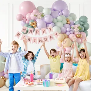 Pastel balloon garland arch kit with gold accents and Happy Birthday banner for party decor