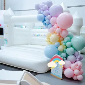 Customized white inflatable castle with macaron balloon arch and gold star decorations