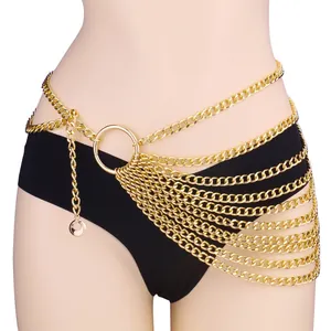 Layered gold body chain with punk style metal rings and cascading fringe detail