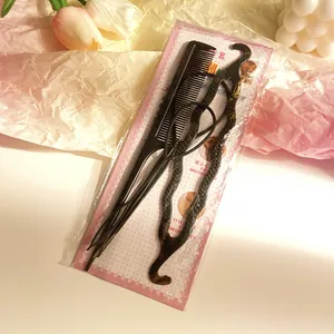 Detailed view of 3-piece hair styling tool set including tail comb and topsy tail