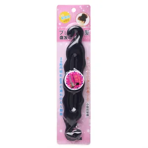 Black hair styling tool for quick buns in pink retail packaging with wave design