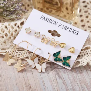6-pair set of gold-toned butterfly and heart stud earrings with sparkling rhinestones