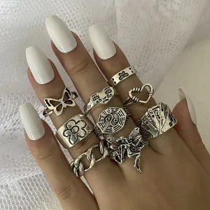 Ensemble de 9 bagues argentées vintage avec motifs papillon, marguerite et yin yang