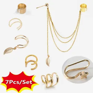 7Pcs gold ear cuff set featuring long chain leaf tassel and diverse cartilage clip earrings
