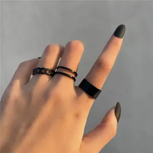 Set of 7 minimalist black knuckle rings featuring chain and smooth band designs for women