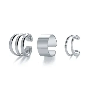 Three-piece silver ear cuff set with minimalist smooth wide and multi-layer ring designs