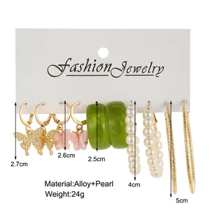 Detail view of pearl and butterfly earring set with size and weight specifications