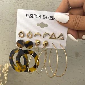 Set of 6 vintage pearl and acrylic hoop earrings featuring gold geometric studs and pendants