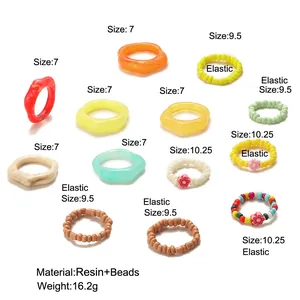 Guida alle taglie dettagliata per il set di 16 anelli colorati in resina e perline