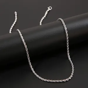 Detail of 3mm silver rope chain with lobster clasp on a black minimalist pedestal