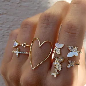 9pcs gold bohemian ring set with butterfly, heart, and cross zircon charms