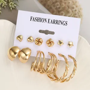 Detailansicht von 6 Paar goldenen Modeohrringen mit Herzen Sternen und Creolen im Set